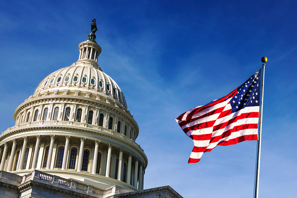 View of the US Capitol dome with the American flag