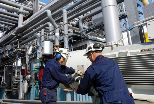 men working in industrial plant