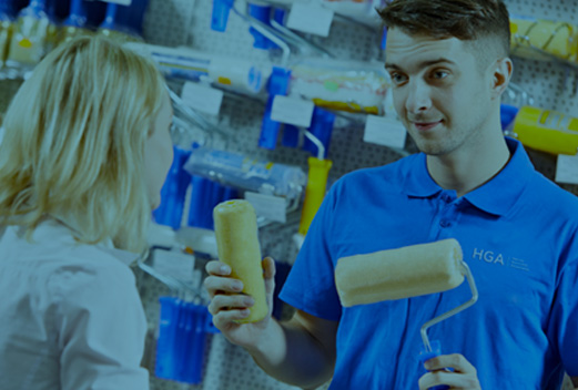 man showing commercial rollers to customer