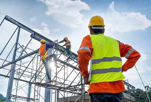 Men working construction with safety gear on